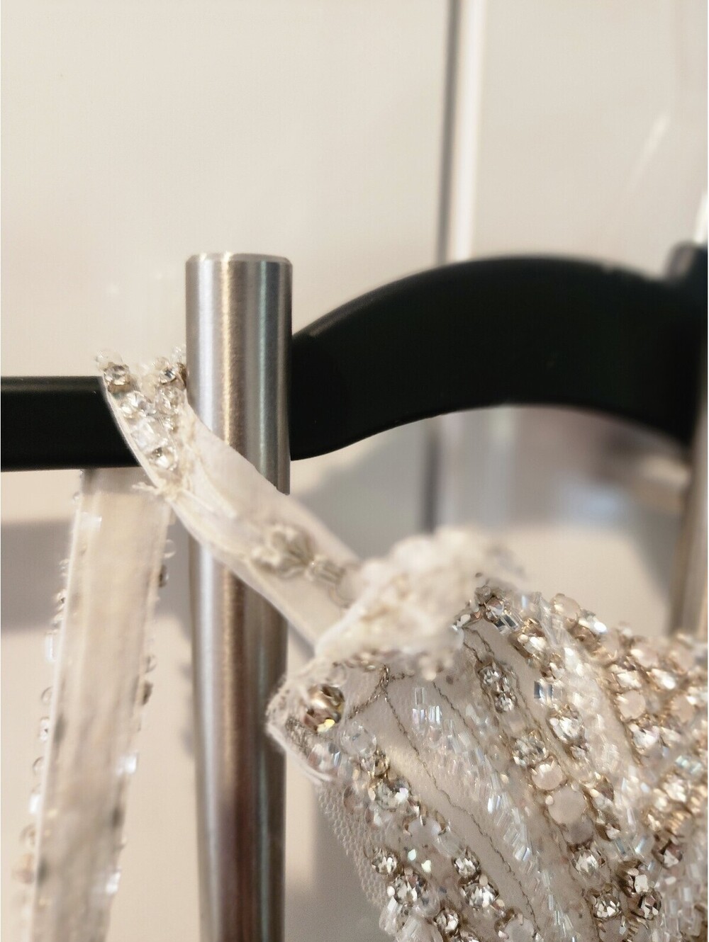 Elegant White Beaded Evening Gown with Sheer Embellished Bodice and Flowing Skit - Picture 6 of 9